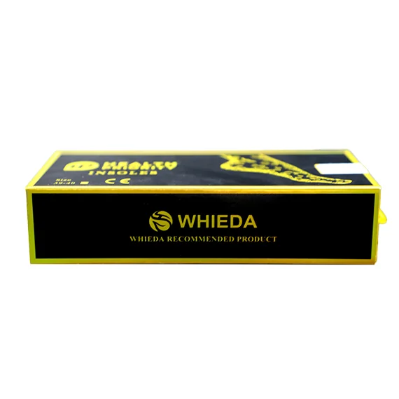 A pair of golden WHIEDA anion insoles from above: relief under the arch, massage points and holes